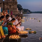 Families worshipping river
