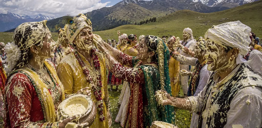 villagers smearing butter on each other during the festival at Dayara Bugyal