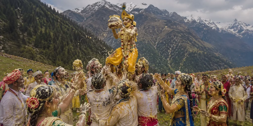 villagers smeared in butter and buttermilk celebrating in a Himalayan meadow