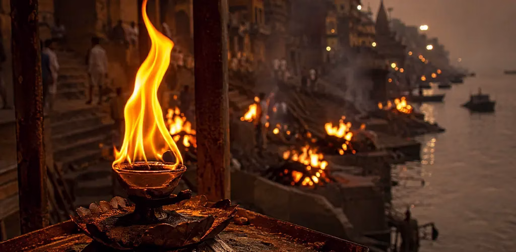 the Akhand Jyot flame at Manikarnika Ghat, source of every pyre lit by the Dom community