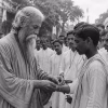 Rabindranath Tagore tying rakhis on the streets of Bengal, 1905