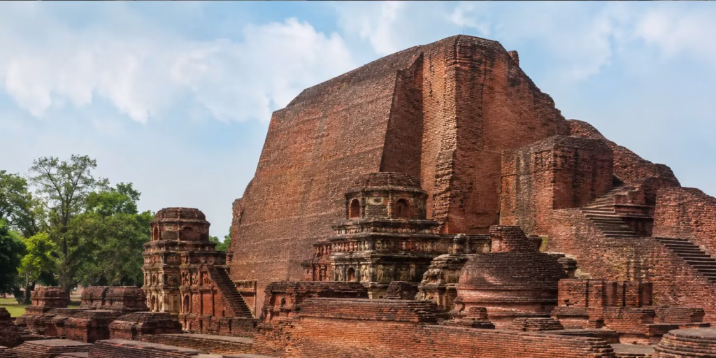 The red brick ruins of Nalanda University standing under an open sky in Bihar