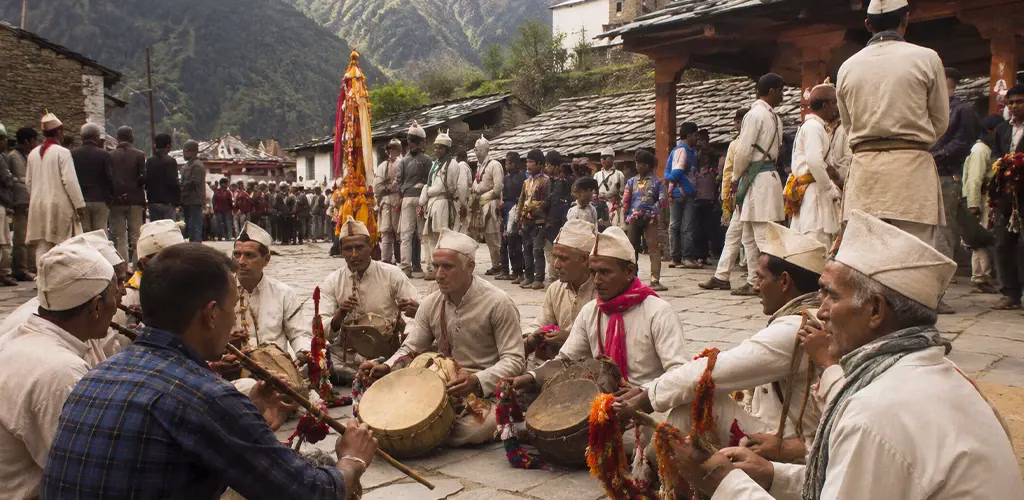 villagers gathering with folk instruments before the start of the Yatra