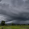 Storm clouds gathering over Indian farmland during monsoon season